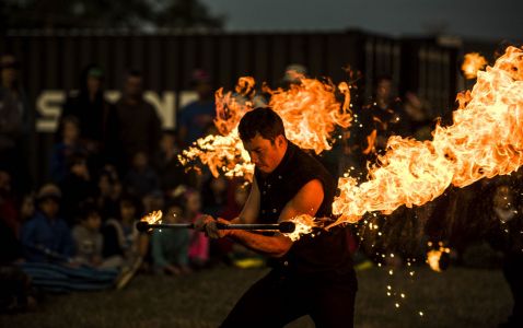 male fire staff performer